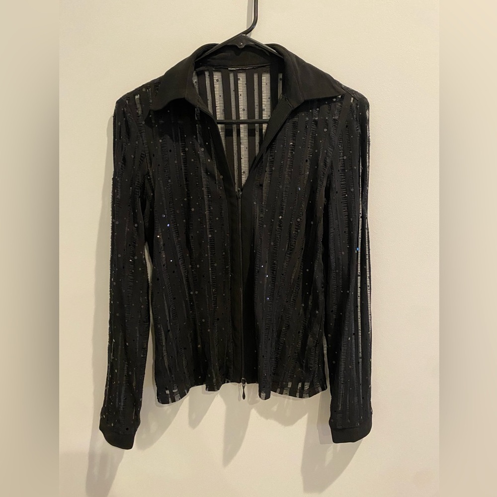 Fun sparkly black top. No tags. Fits like small.